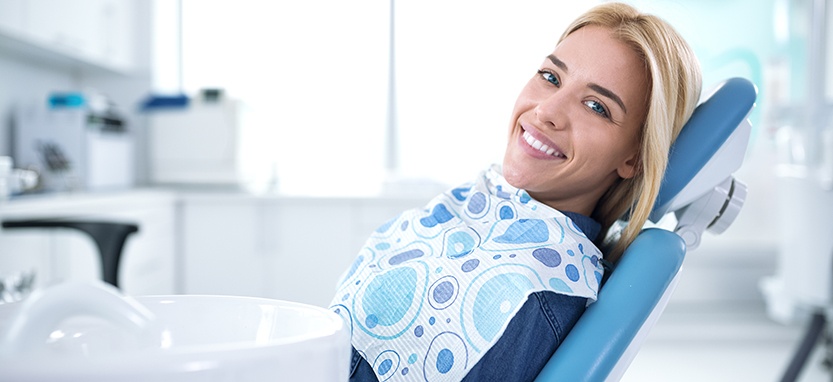 Smiling woman sitting in dental office