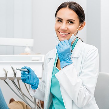 Dentist smiling at patient's dental exam