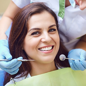 Closeup of woman smiling during dental checkup 