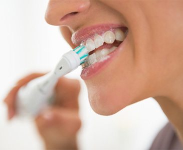 Woman brushing her teeth