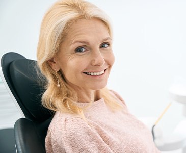 Woman smiling in the dental chair